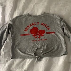 a long sleeve partially cropped shirt